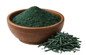 Spirulina powder in a wooden bowl, healthy food supplement.