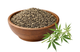 Wooden bowl filled with nutritious hemp seeds next to a cannabis leaf.